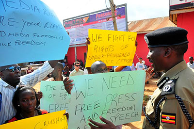 Journalists and activists protested the police siege of The Monitor. (Daily Monitor)