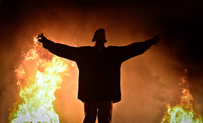 Protesters light fires during clashes between supporters and opponents of the Muslim Brotherhood. (AFP/Mohamed el-Shahed)