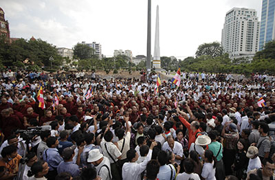 Buddhist monks protest in Rangoon in support of demonstrators injured at a rally at a copper mine. (Reuters/Soe Zeya Tun)