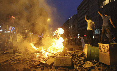 Journalists were attacked, detained, and obstructed while reporting on clashes between police and protesters on Sunday. (Reuters/Serkan Senturk)