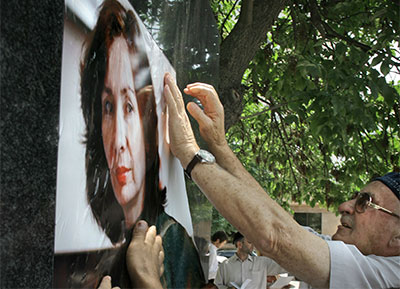 People place a poster of Natalya Estemirova on a monument to killed journalists in the Chechen capital, Grozny, southern Russia on, July 15, 2011. (AP/Musa Sadulayev)