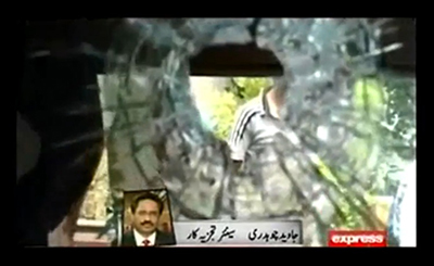 An Express TV report shows the damage left by today's attack on the Express Media Group. (YouTube/Express TV)