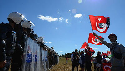 Protesters demonstrate outside the courthouse on Monday, where several journalists were among those convicted for participation in the alleged Ergenekon plot. (AP)