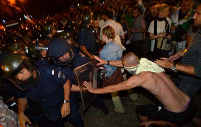 Protesters clash with riot police during a protest in Sofia in July. (AP/Georgi Kozhuharov)