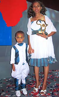 Woubshet Taye's wife Berhane Tesfaye and their son accepted an award on behalf of the imprisoned journalist. (CPJ/Sue Valentine)