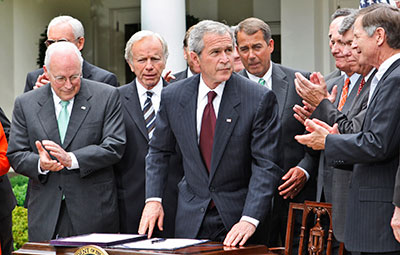 President George W. Bush is applauded after signing the FISA Amendments Act of 2008 in the White House Rose Garden. (AP/Ron Edmonds)