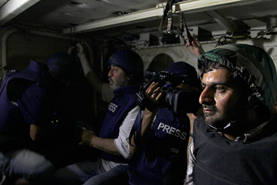 Journalists ride in an army soldiers' carrier to the front line during clashes between forces loyal to Syrian President Bashar al-Assad and opposition fighters on August 24, 2013. (Reuters/Khaled al-Hariri)