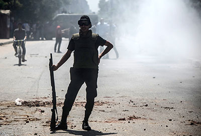 A police officer is seen in Cairo amid clashes between security forces and supporters of the Muslim Brotherhood. (AFP/Mohamed el-Shahed)