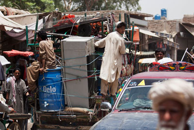 Villagers flee Pakistani tribal areas in North Waziristan following a massive crackdown on militants by the Pakistan army. (AP/B.K. Bangash)