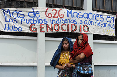 Survivors of Guatemala's civil war protest in May 2013 after General José Efraín Ríos Montt’s conviction for genocide was quashed. A new trial for the former dictator is due to start in January. (AFP/Johan Ordonez)
