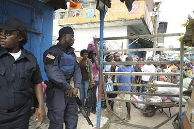 Security forces guard a checkpoint in an area of Monrovia that was in quarantine for several days as part of government efforts to try to contain Ebola in Liberia. (Reuters)