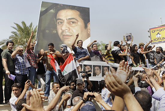 Protesters demonstrate against the killing of Iraqi journalist Hadi al-Mehdi, who was shot dead in 2011. No one has been held responsible. (AP/Karim Kadim)