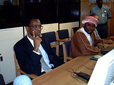 Ferdinand Nahimana, left, of RTLM, and Hassan Ngeze, right, editor of Kangura, in December 2003. A U.N. tribunal found them guilty of using the media to incite genocide. (AFP/Stella Vuzo)