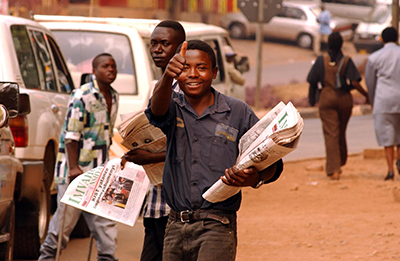 A Rwandan sells papers in Kigali. As stability returned to the country, a series of new publications flooded the market. (AFP/Marco Longari)
