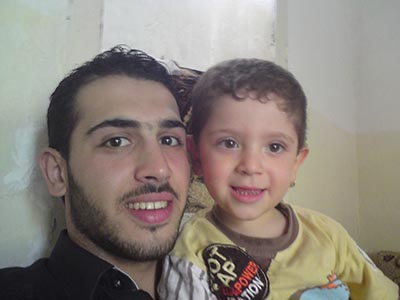 Tammas, with his cousin, in the Syrian town of Al-Qusayr. (Rifaie Tammas)