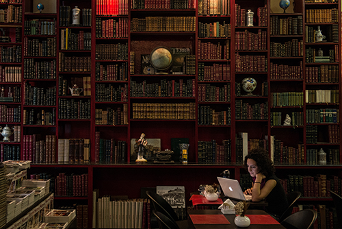 A woman uses a laptop at a café in a Rio de Janeiro bookstore. Two bloggers in Brazil say they received threats after reporting on crime and inequality. (AFP/Yasuyoshi Chiba)