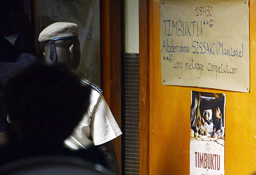 A poster advertises a screening of Timbuktu at the Pan-African Film Festival in Burkina Faso. The Oscar-nominated film on Islamic militancy was barred from a Paris suburb. (AFP/Ahmed Ouoba)