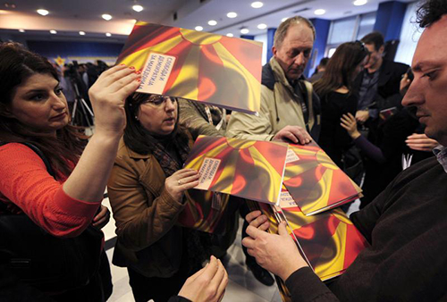 Transcripts of alleged wiretap recordings are handed out in Skopje on February 27. Claims that journalists as well as ministers were under surveillance have highlighted press freedom conditions in Macedonia. (Reuters/Ognen Teofilovski)