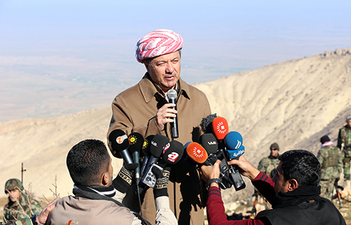 Iraqi Kurdish leader Masoud Barzani speaks to journalists at Mount Sinjar, west of Mosul, in December 2014 as fighters take on the Islamic State. The militant group kidnapped several journalists when it took over Mosul. (AFP/Safin Hamed)