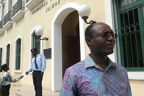 Rafael Marques de Morais outside a Luanda court on May 25. Criminal defamation charges have been reinstated against the investigative journalist just days after they were dropped. (AFP/Estelle Maussion)
