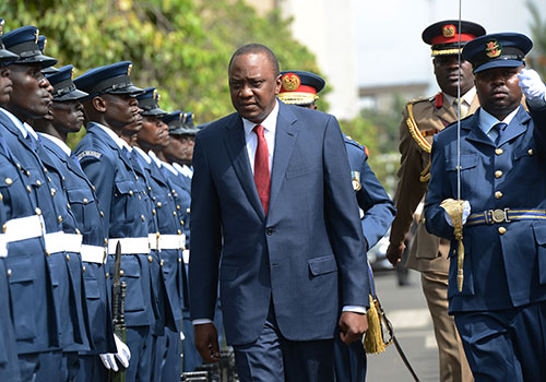 President Uhuru Kenyatta arrives at parliament in March 2015. His rule has been described as hostile to press freedom, local journalists say. (AFP/Simon Maina)
