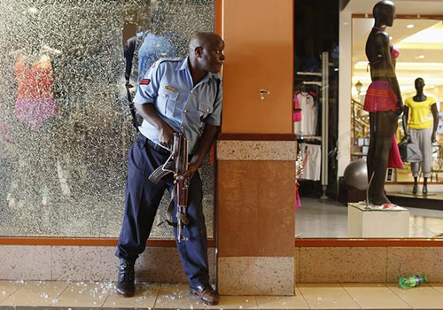 A police officer responds to a mass shooting in Nairobi’s Westgate Shopping Center in September 2013. In the aftermath of the shooting, the government is trying to restrict reporting on terror attacks. (Reuters/Siegfried Modola)