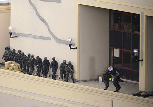 Kenyan soldiers search the roof of Westgate Shopping Center after gunmen open fire on shoppers. The government has moved to restrict reporting on terror attacks. (Reuters/Noor Khamis)