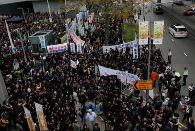 Journalists and their supporters gather outside the government headquarters in Hong Kong on March 2, 2014, in support of Kevin Lau. (AP/Vincent Yu)