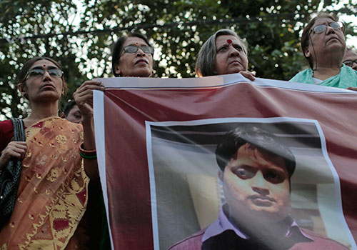 A banner showing murdered Bangladeshi blogger Ananta Bijoy Das is held up. Das was denied a visa to Sweden days before he was killed. (AP/A.M. Ahad)