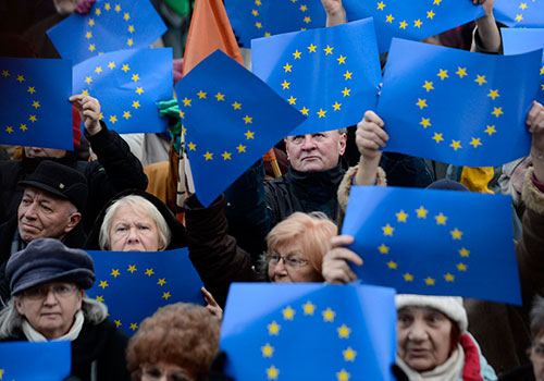 EU flags are held up in Budapest during a rally calling on the EU to help rein in Hungary’s government. (AP/Tamas Kovacs)
