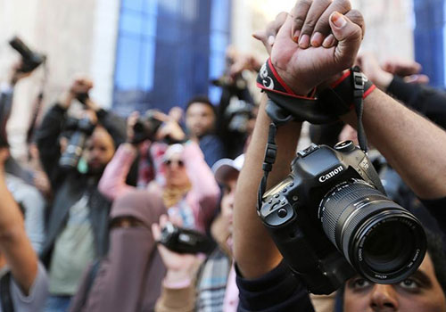 Supporters of imprisoned photojournalist Shawkan protest in Egypt. The EU has condemned the imprisonment of journalists in Egypt while acknowledging the country’s regional importance. (Reuters/Mohamed Abd El Ghany)