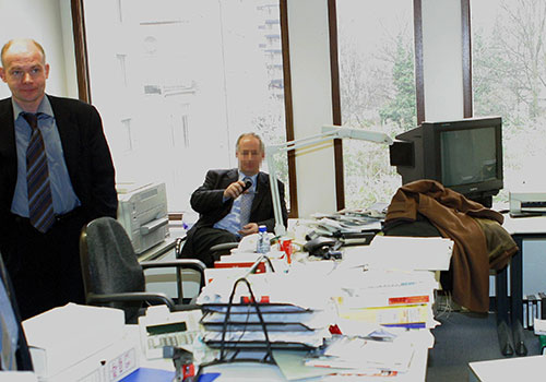 Hans-Martin Tillack, of Stern magazine, pictured left during a raid on his office by Belgian police after reporting on allegations made by a whistleblower. (AFP/Tierry Monasse)