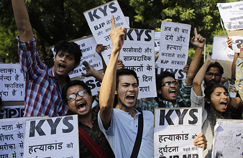 A protest in Delhi over the murder of a Muslim farmer killed over claims he slaughtered a cow. Violence over the tightening of beef laws in parts of India is having an impact on some journalists. (AP/Altaf Qadri)