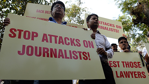 Indian journalists march in protest at attacks on colleagues outside a Delhi court. (AFP/Indranil Mukhejee)