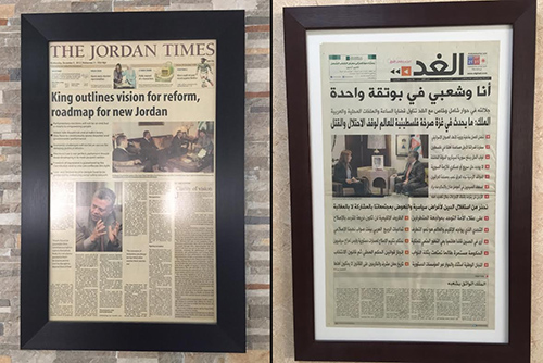 A composite of framed front pages featuring King Abdullah II promising reform hang on the walls of Jordanian newspapers, Jordan Times, left, and Al-Ghad, right. Jumana Ghumainat, of Al-Ghad, says the king's support for her paper has been important. (CPJ/Jason Stern)