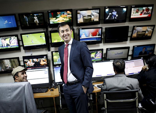 Tolo TV news director Lotfullah Najafizada, pictured second left in the Kabul newsroom, says staff remain committed to journalism despite the threats and risk of attack. (Reuters/Ahmad Masood)