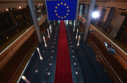 The EU flag hangs in the European Parliament in Strasbourg. A series of votes on legislation could impact journalists in member states. (AFP/Patrick Hertzog)