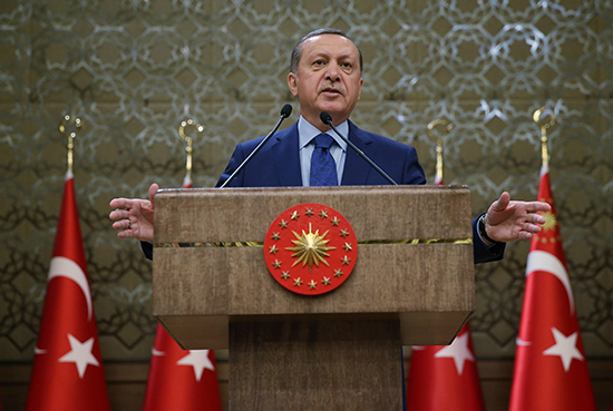 Turkish President Recep Tayyip Erdoğan addresses local officials at his palace in Ankara on March 20, 2016. Erdoğan said Russian and U.S. arms were finding their way to Kurdish groups Turkey classes as terrorist organizations. (Murat Cetinmuhurdar/Pool/AP)