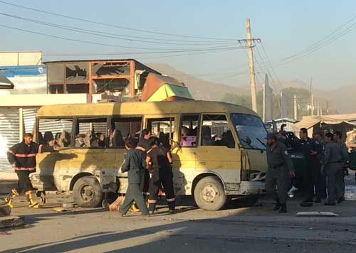 Police and firefighters are seen at the site of a suicide blast in Kabul on June 20, 2016. Several journalists were obstructed from reporting at the scene. (Reuters/Mirwais Harooni)