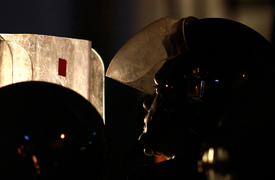 Maldivian police watch over an opposition demonstration in February 2012. (Reuters/Dinuka Liyanawatte)