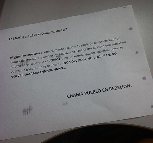 A threatening note, pictured, from a pro-government group was left outside the vandalized offices of El Nacional. (El Nacional)
