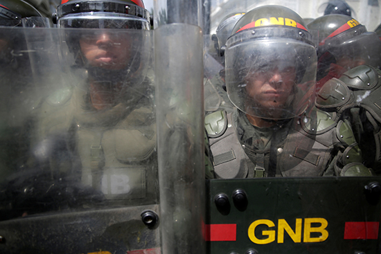 Venezuelan security forces in riot gear stand in front of the National Assembly in Caracas, October 27, 2016. (Reuters/Marco Bello)