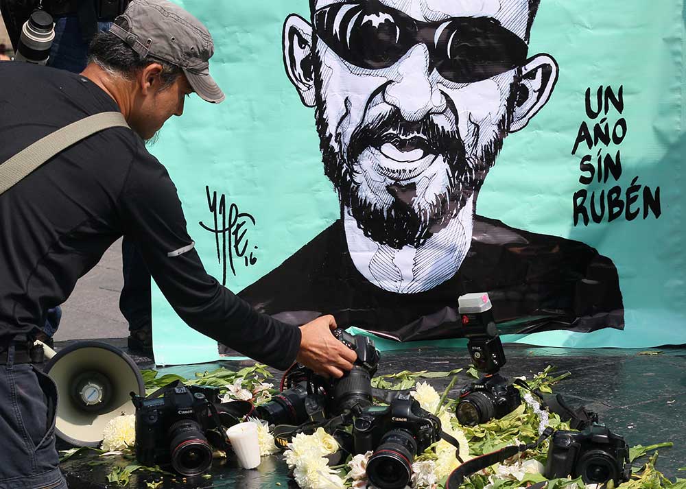 A tribute to photojournalist Rubén Espinosa, who was murdered in Mexico City in 2015. No one has been convicted of his killing.  (AFP/Hector Guerrero)