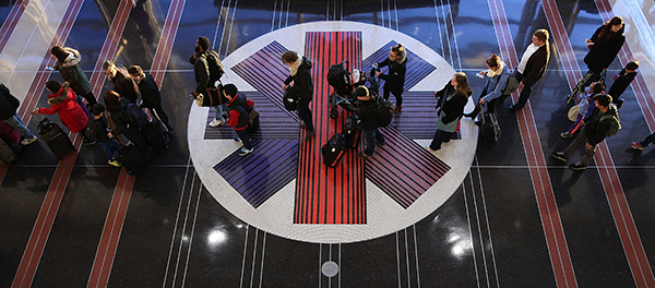 Travelers wait for a security check at Ronald Reagan Washington National Airport in November. Journalists traveling to the U.S. can face searches that can risk the confidentiality of their sources. (Alex Wong/Getty Images/AFP)