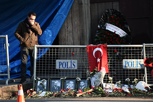 Tributes are left to victims of a terror attack at an Istanbul nightclub. Turkey has ordered a news ban over coverage of the incident. (AFP/Ozan Kose)