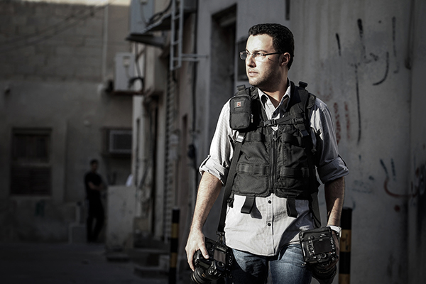 Mohammed al-Shaikh, a former AFP photographer pictured while covering protests in Manama in 2013, is detained in Bahrain. (AFP/STR)