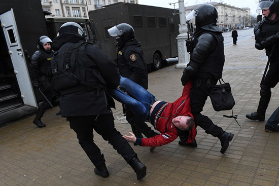 Belarusian police detain a man at a March 25, 2017, protest in Minsk. (AFP/Vasily Maximov)