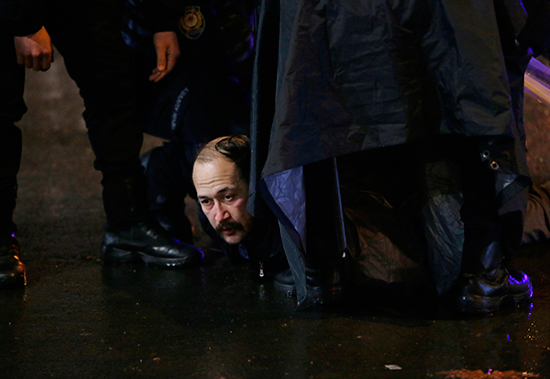 Police detain a protester outside the Supreme Board of Elections in Ankara, April 16, 2017. (AP/Burhan Ozbilici)