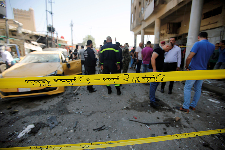 Police tape cordons off the site of a car bomb attack in Baghdad, May 30, 2017. (Reuters/Khalid Al-Mousily)