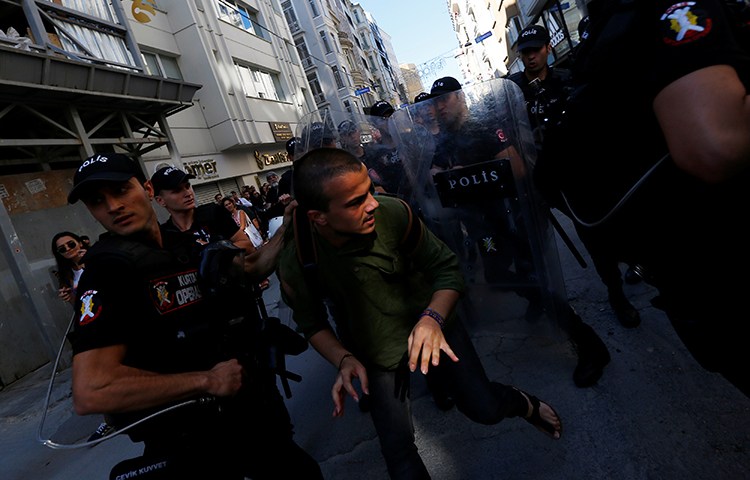 Police disperse marchers who had tried to gather for an LGBTQI pride march in Istanbul, June 25, 2017. Police also briefly detained an AP reporter (not pictured here) at the march, according to reports. (Reuters/Murad Sezer)